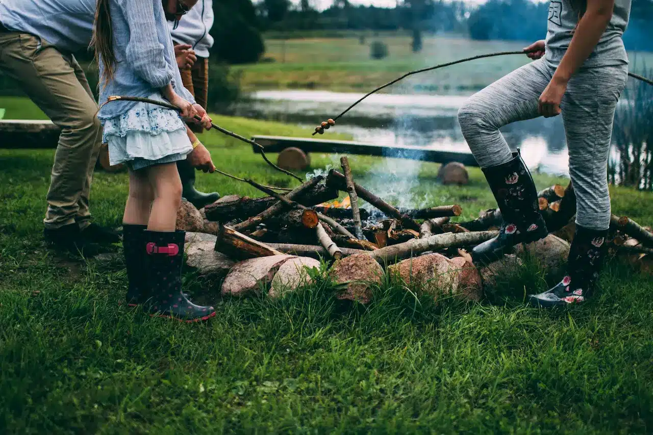 Family Camping Around A Fire