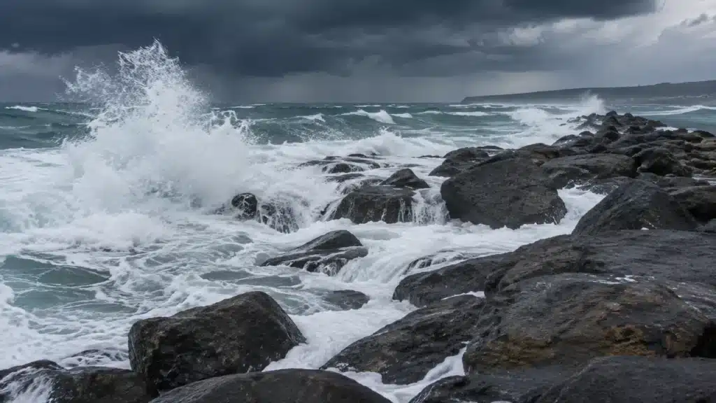 Storm surge washing over the low end of the rock breakwater